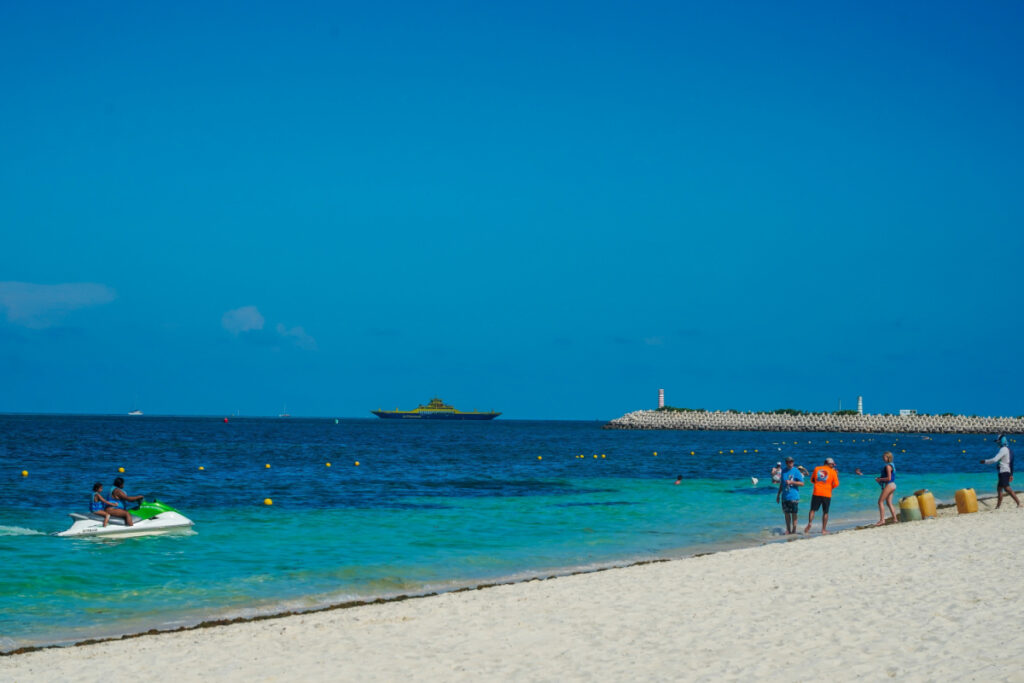 Tourists on a Beach in Playa Mujeres Cancun, Mexico on a Summer Day