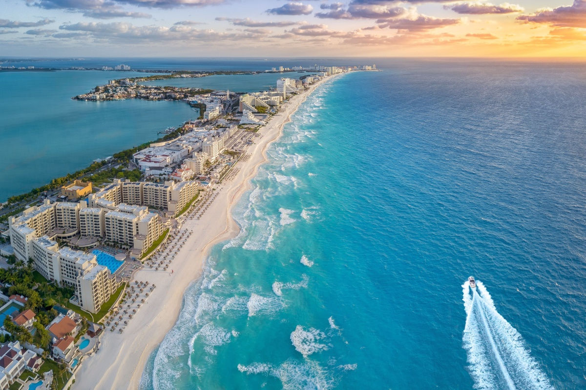 aerial view of a white sand beach in the hotel area in cancun 