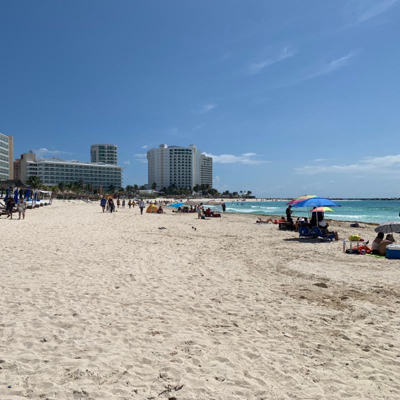 Tourists on a Beautiful White Sand Beach in Cancun, Mexico