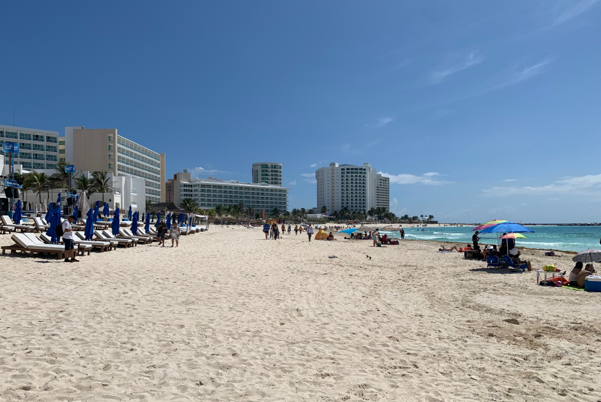 Tourists on a Beautiful White Sand Beach in Cancun, Mexico