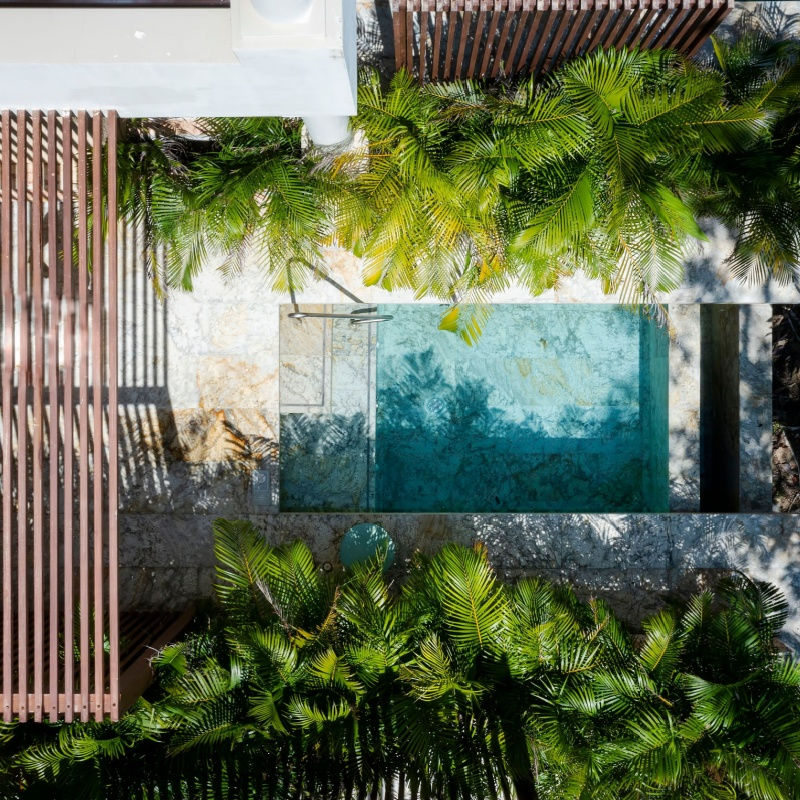 a pool in a relaxing tulum hotel