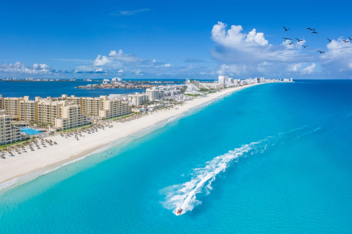 aerial view of cancun's long coastline and blue water