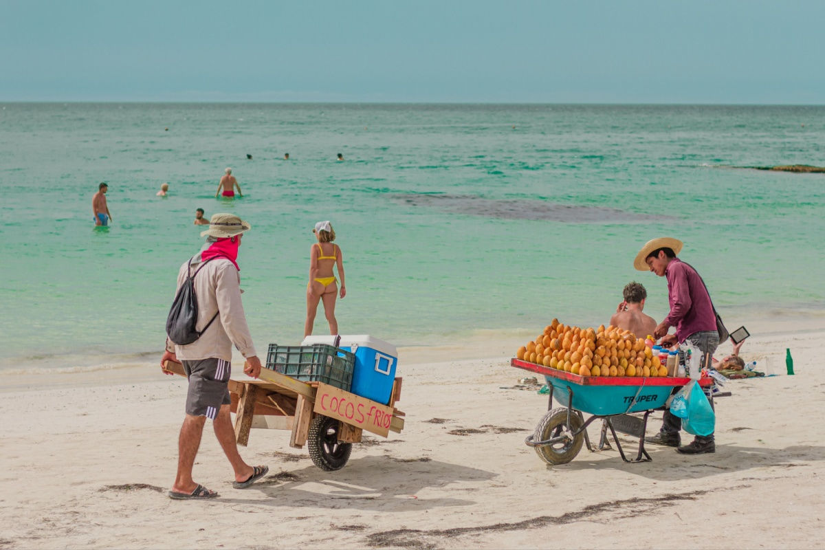 cancun beach vendors on a busy summer day