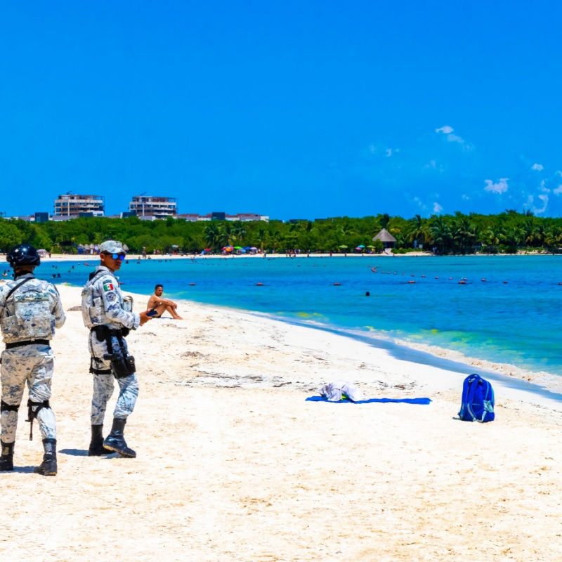 police patrolling a local cancun beach 