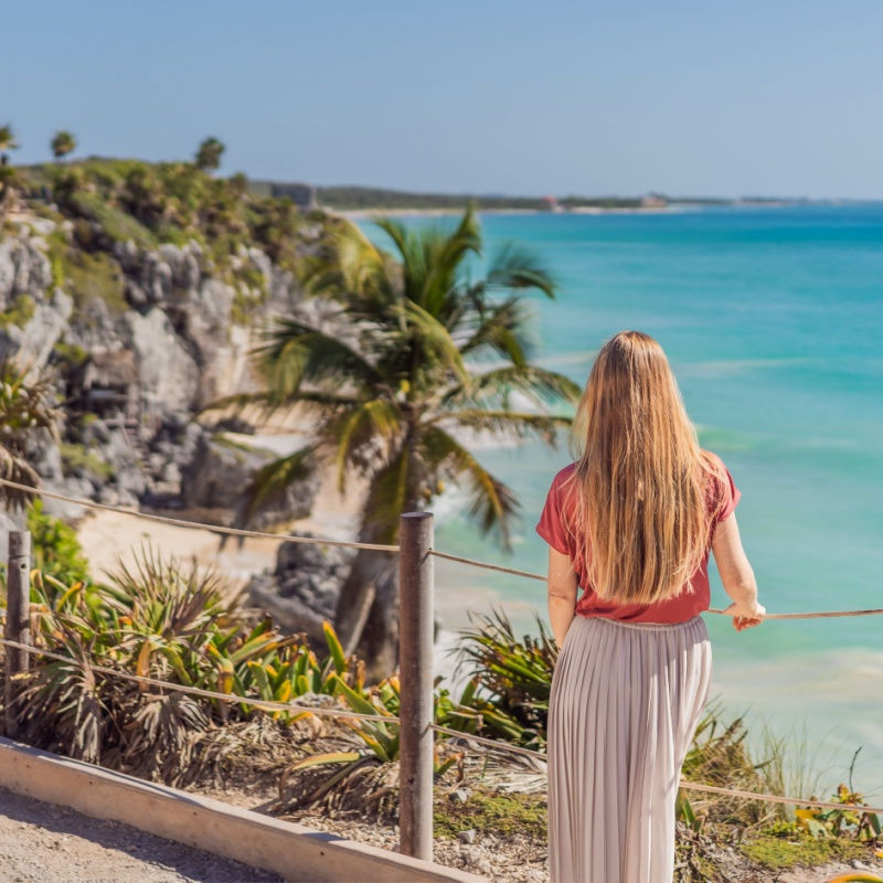 a female traveler admiring tulum