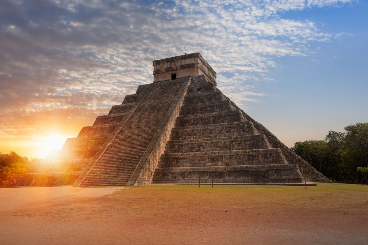 the popular chichen itza ruins in yucatan during sunset