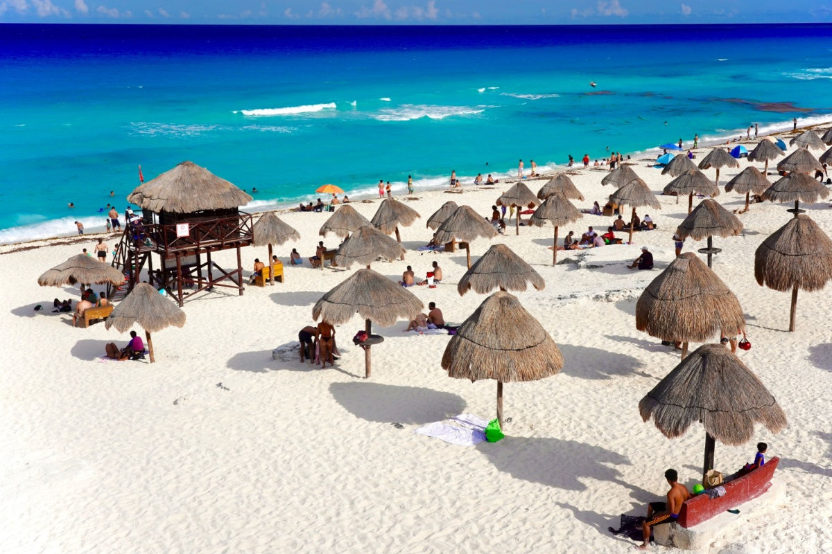 a white sand beach in cancun with blue water