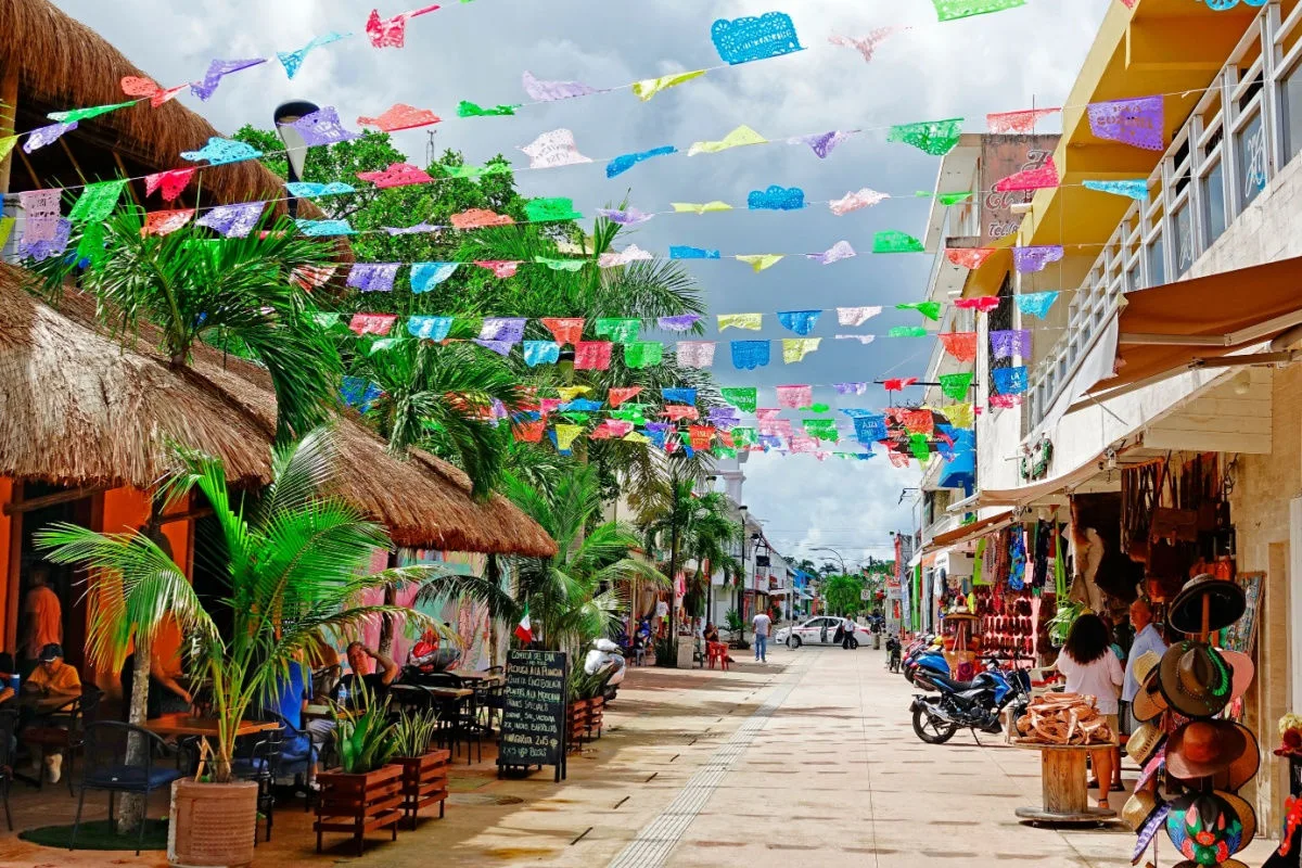 a street in cozumel old town with colorful scenery