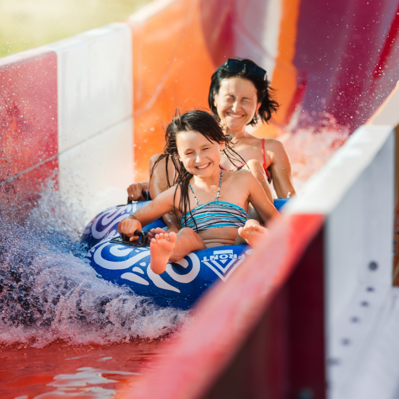 Mother and Daughter on a Water Slide