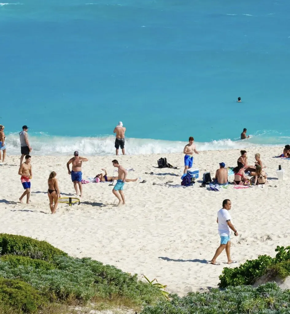 Cancun Beach filled with tourists having fun