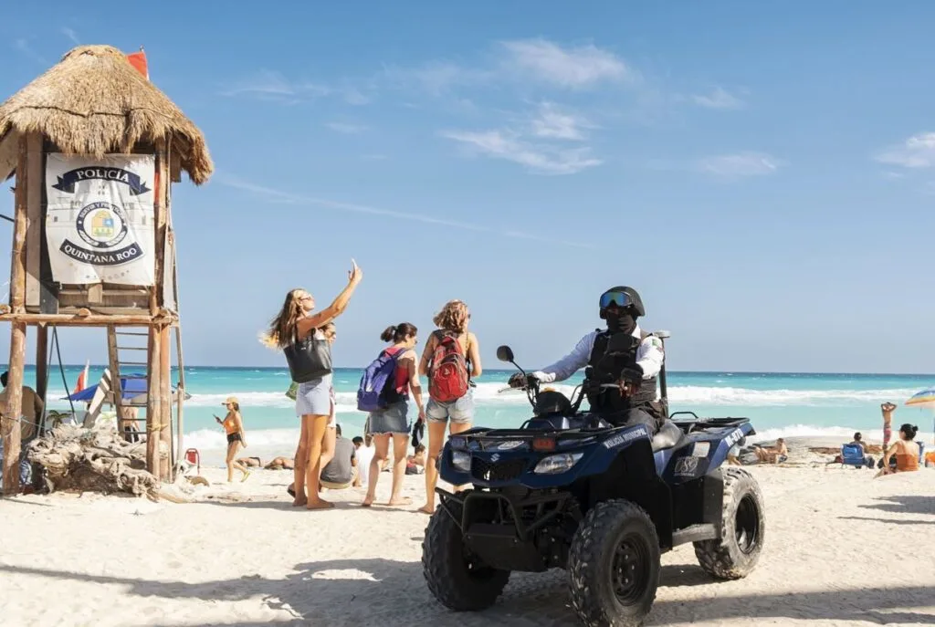 Police officer patrols Cancun beach