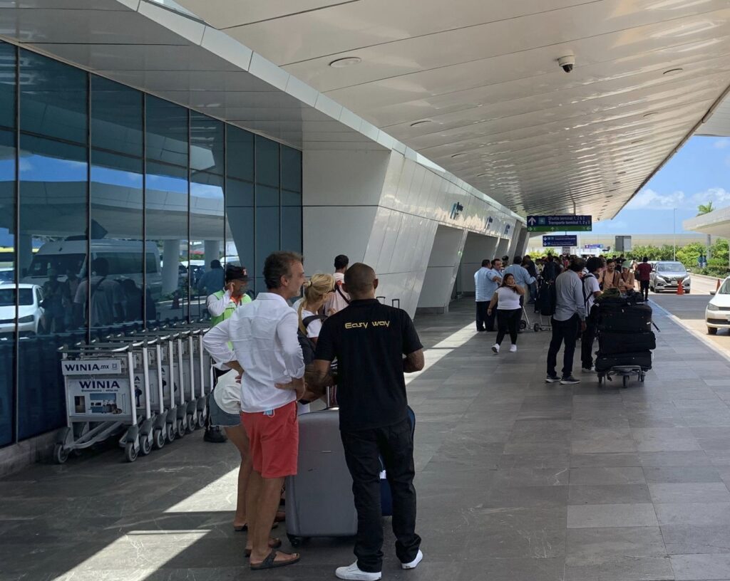 Passengers wait at cancun airport