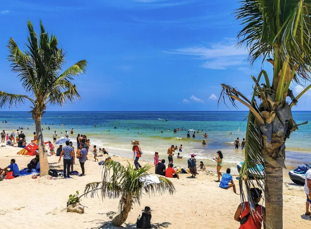 Tourists on White Sand Beach