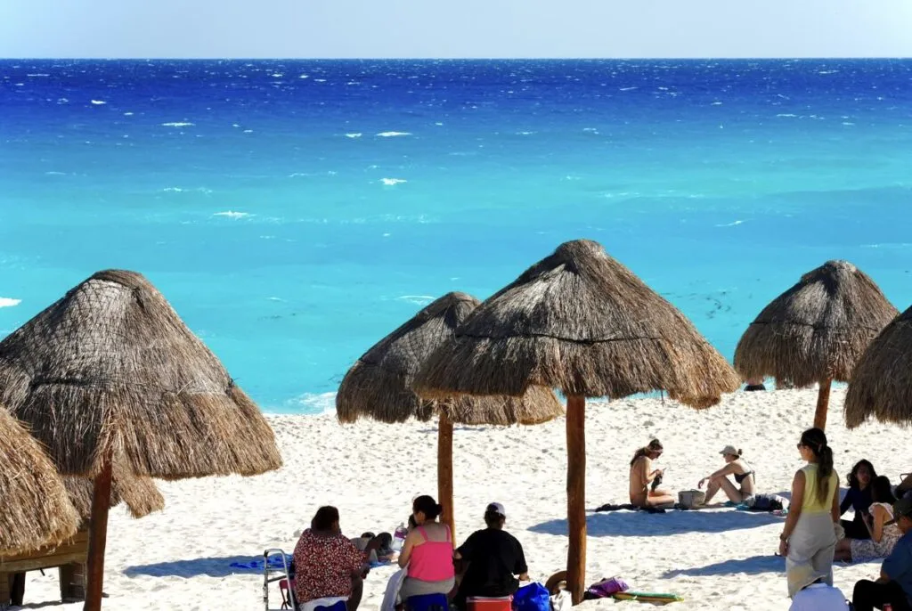 Tourists on beach in Cancun