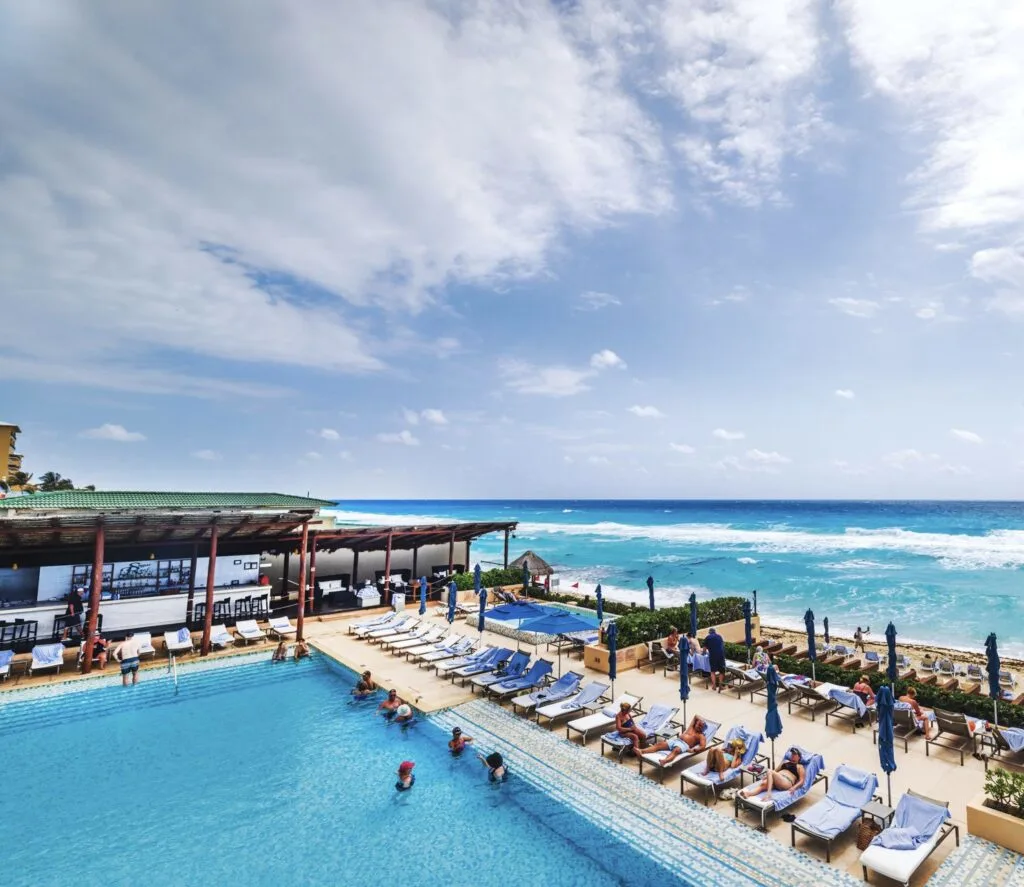 Cancun resort pool and tourists
