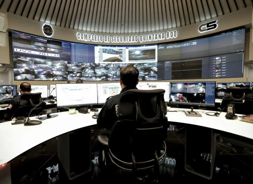Officer monitors Cancun high tech cameras