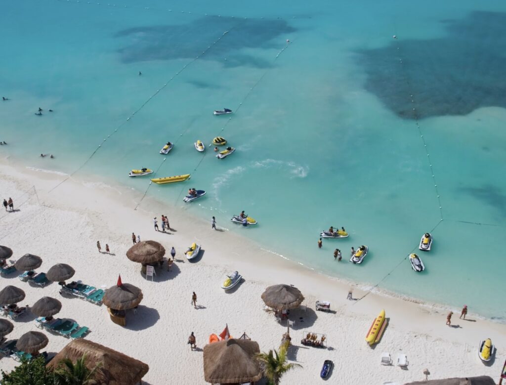 Beach blocked by jetskis and rental chairs