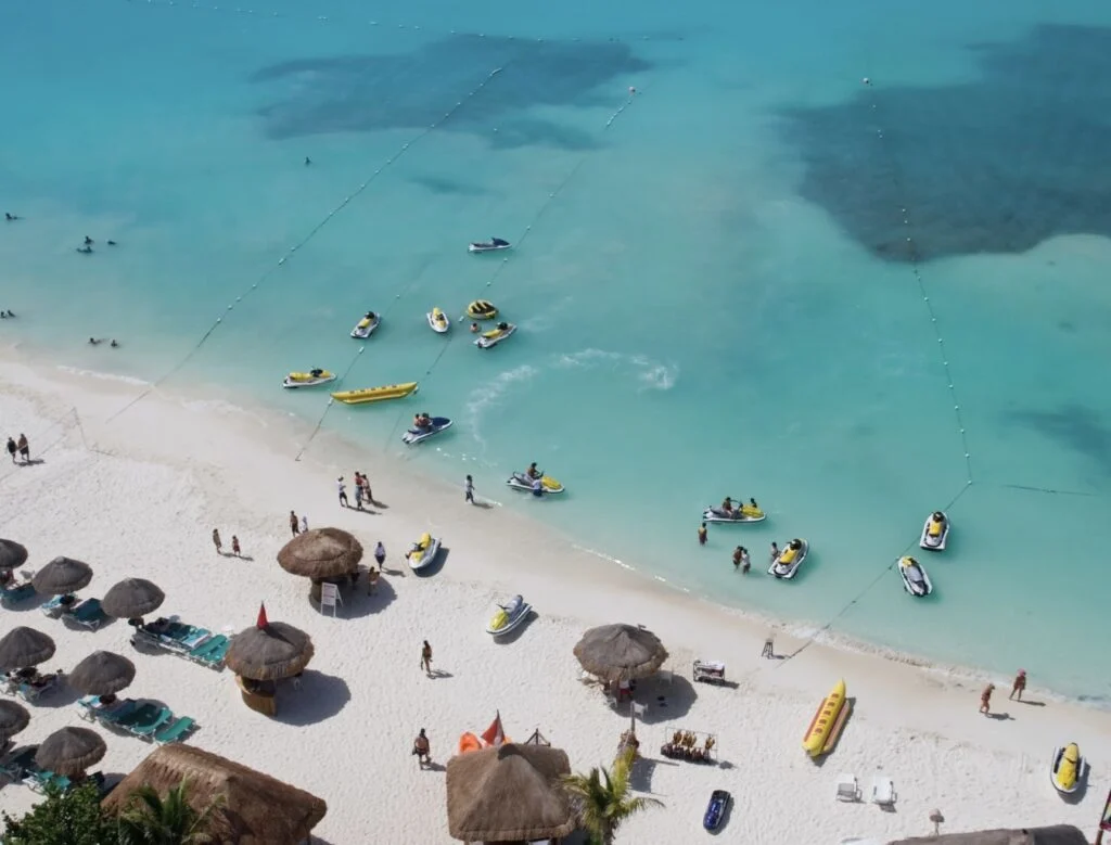 Beach Chairs and Palapas line Cancun beach