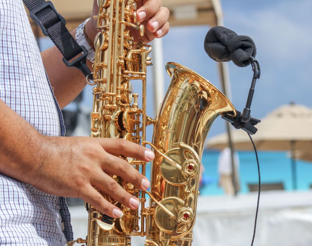 Man playing Saxaphone on cancun Beach 