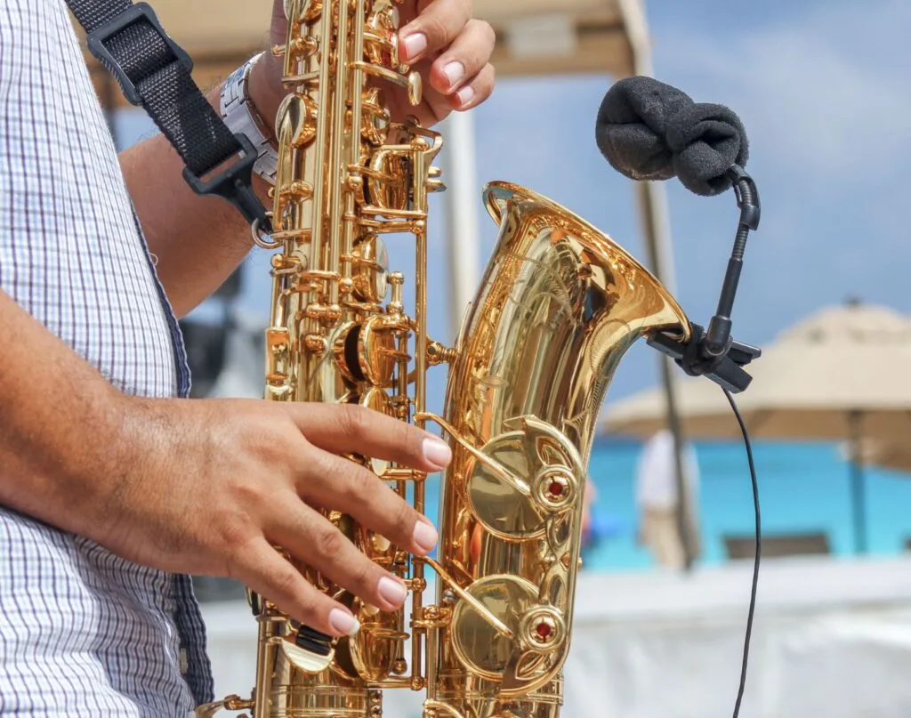 Man playing Saxaphone on cancun Beach