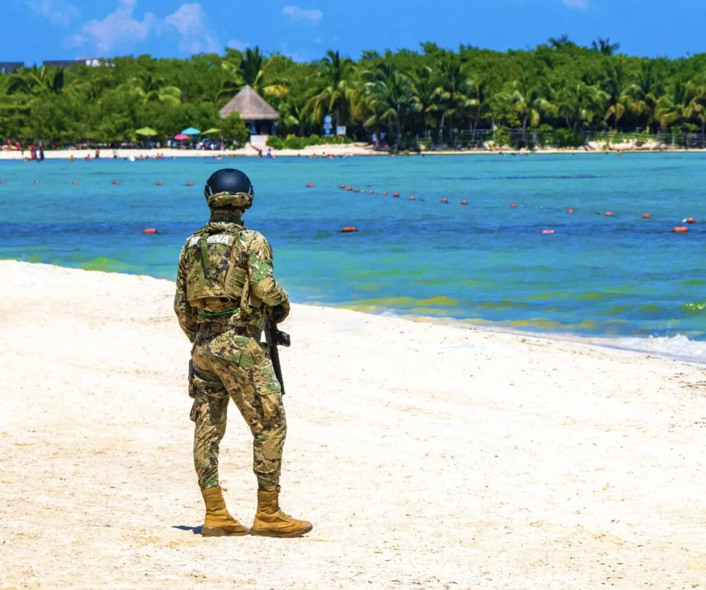 Military soldier on Playa Del Carmen Beach