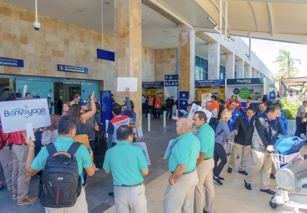 TOur drivers wait for passengers outside cancun airporta