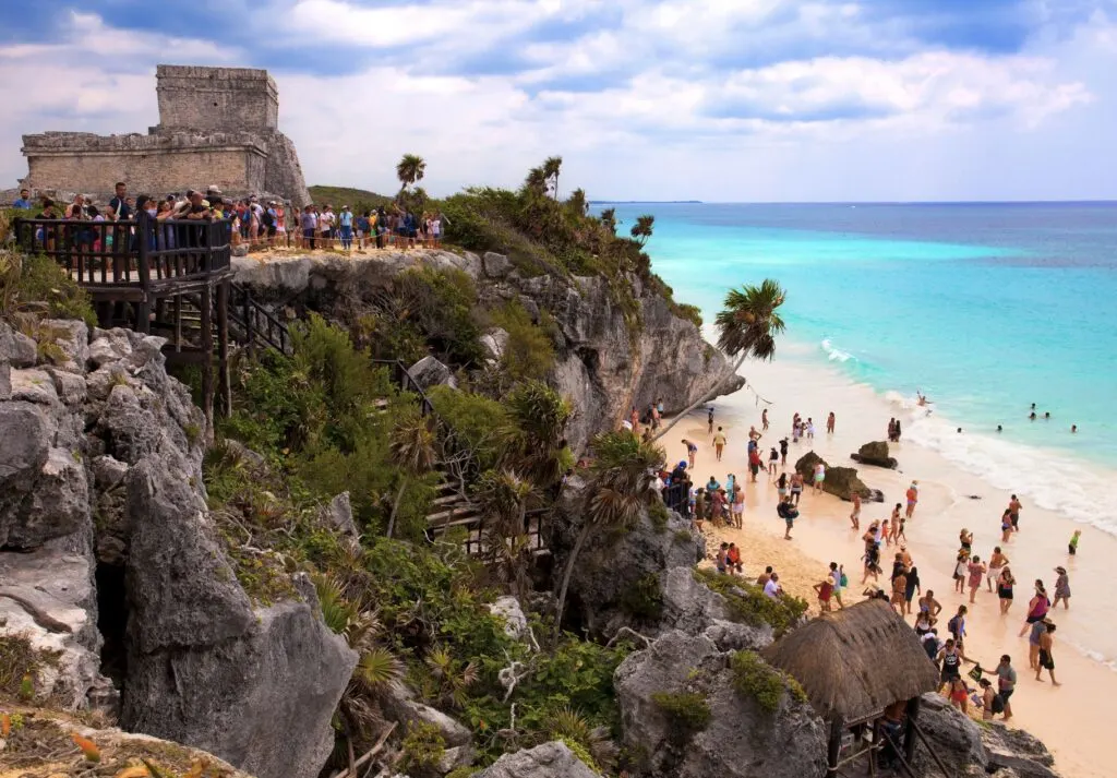 Tourists at Tulum ruins and beach