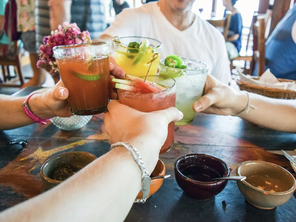 Tourists at cancun restaurant cheers