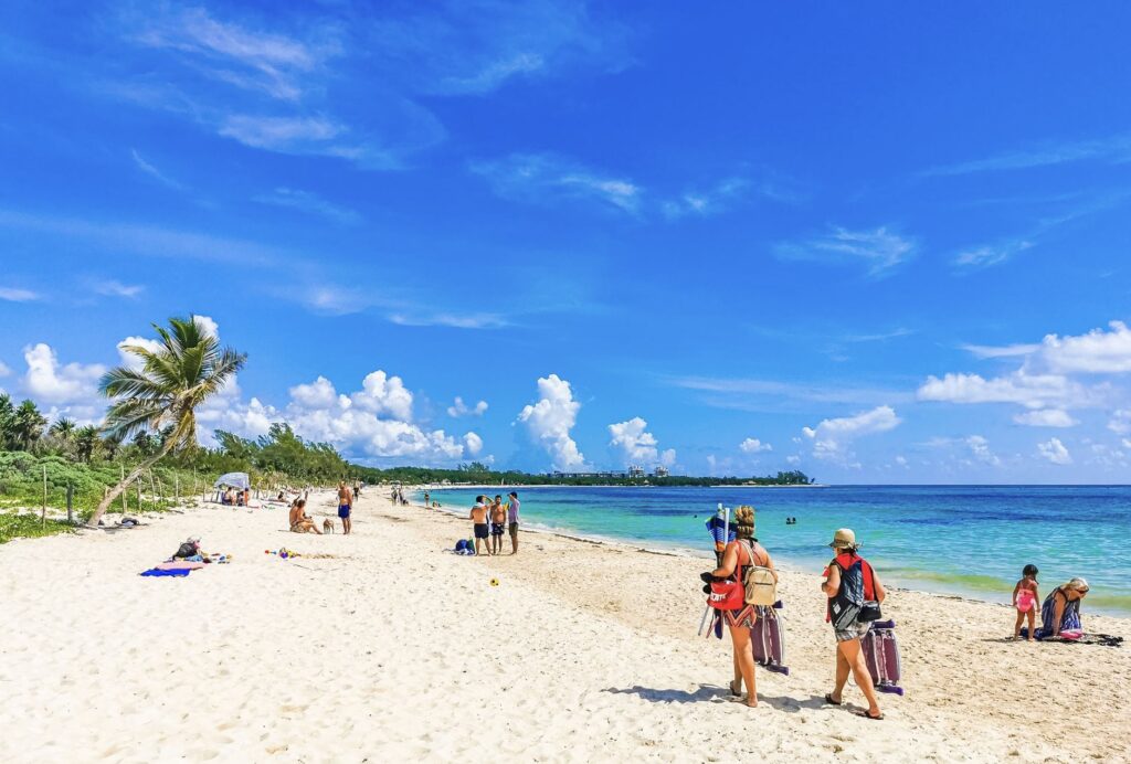 Tourists on Sunny cancun beach