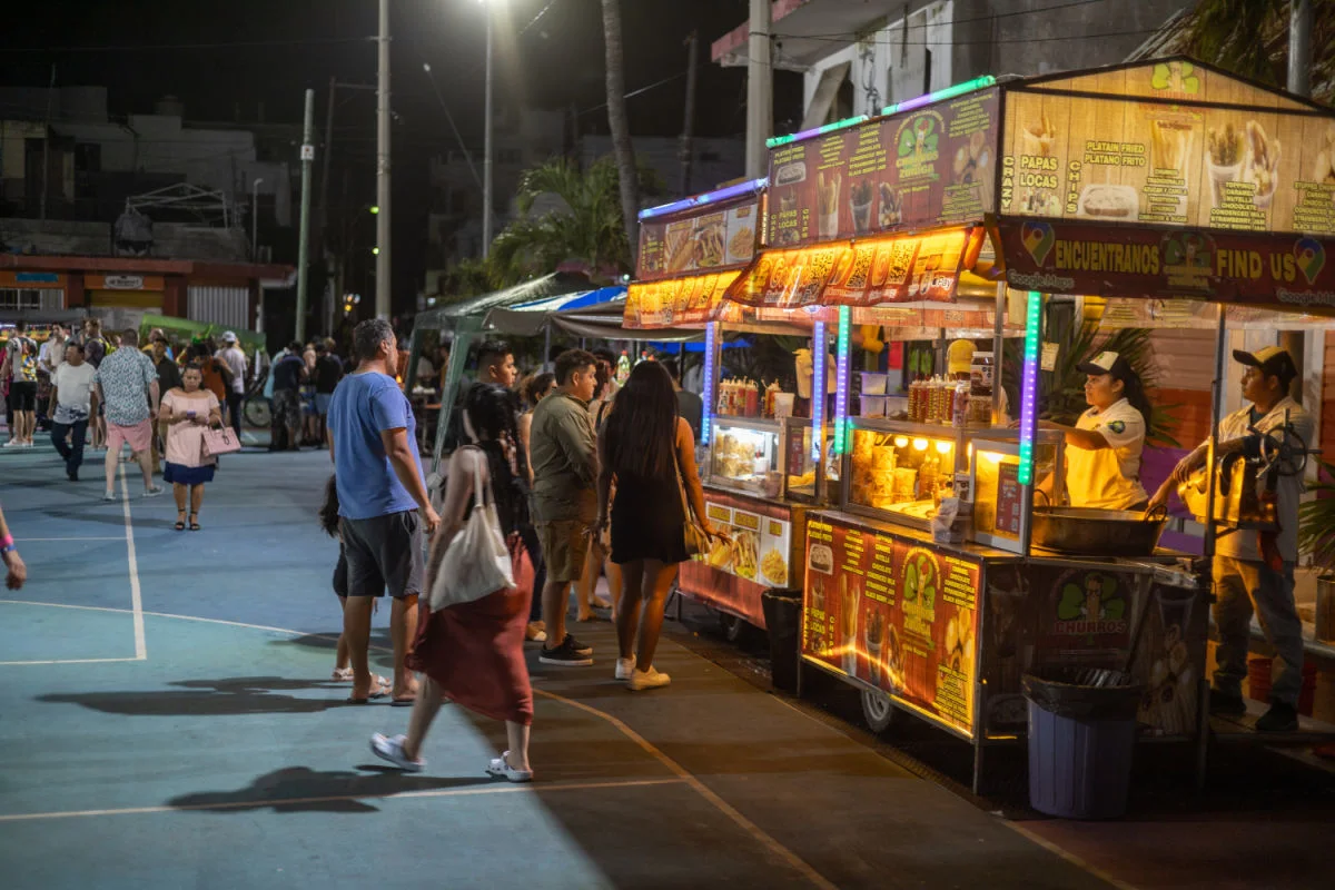 ISLA MUJERES, MEXICO People in Line at Papas and Banderillas Stall in Isla Mujeres at night