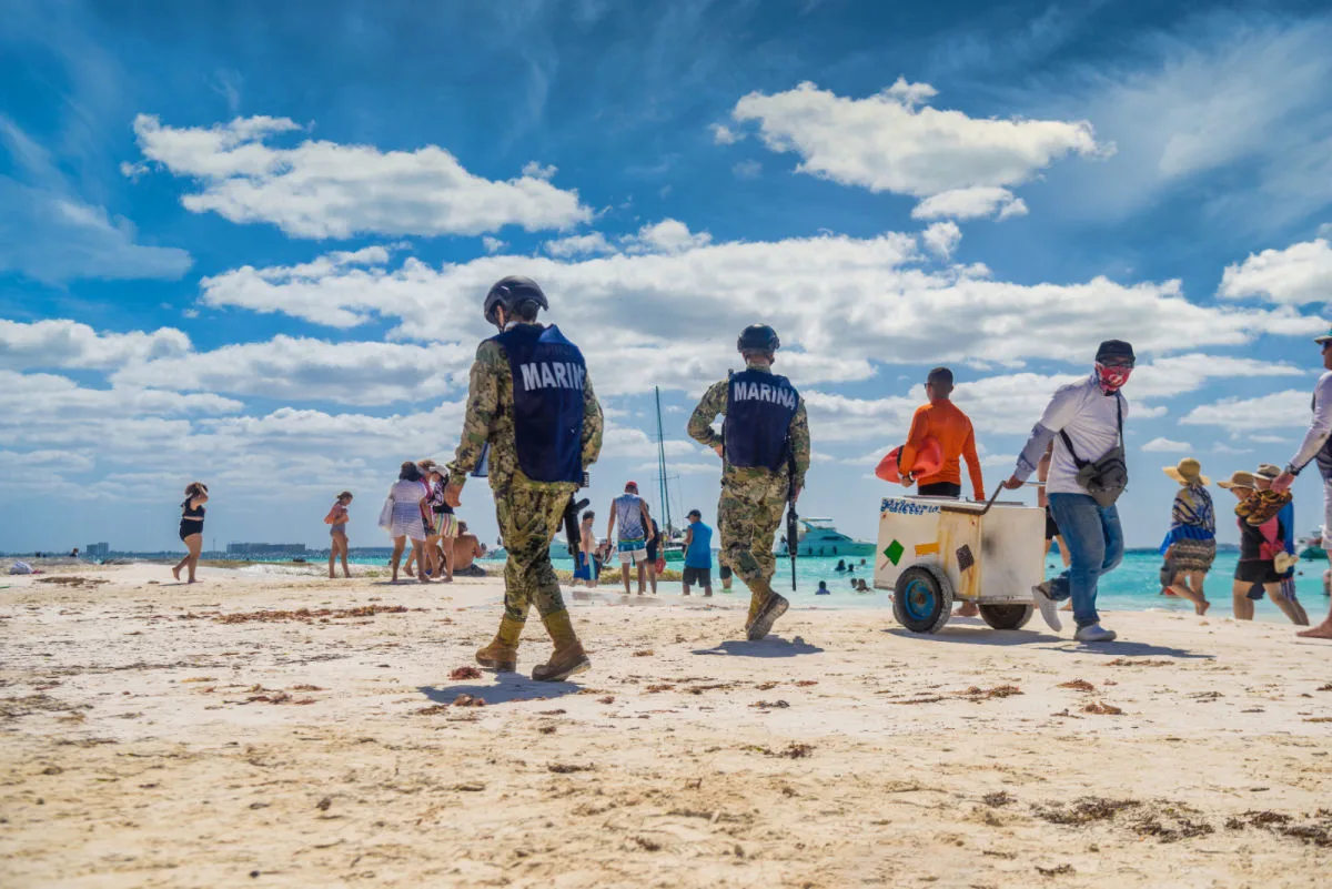 Troops patrolling a beach in Isla Mujeres