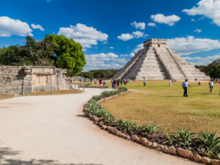 CHICHEN ITZA, MEXICO - Crowds of tourists visit the Kukulkan pyramid at the archeological site Chichen Itza.