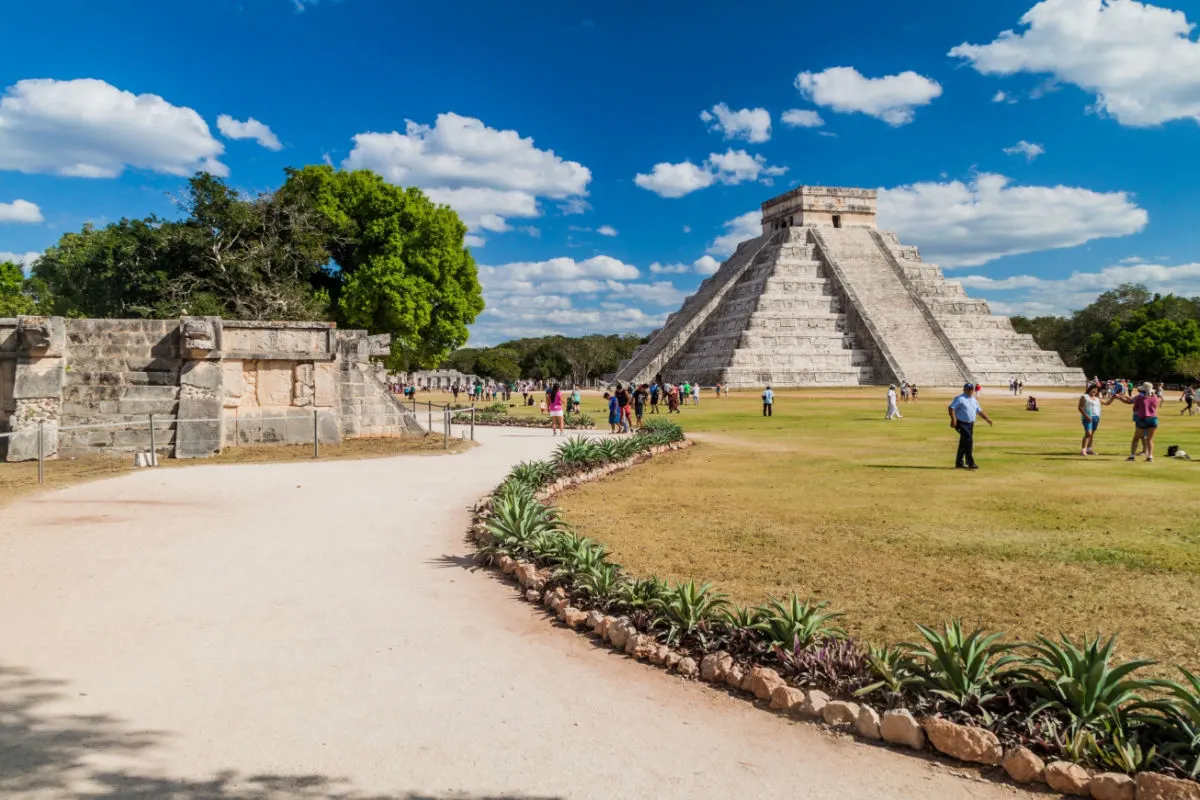 CHICHEN ITZA, MEXICO - Crowds of tourists visit the Kukulkan pyramid at the archeological site Chichen Itza.