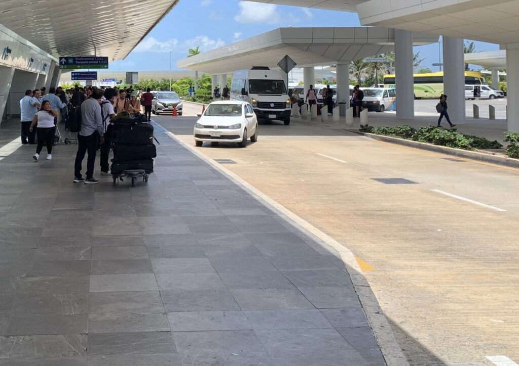 Passengers wait for rides Cancun airport