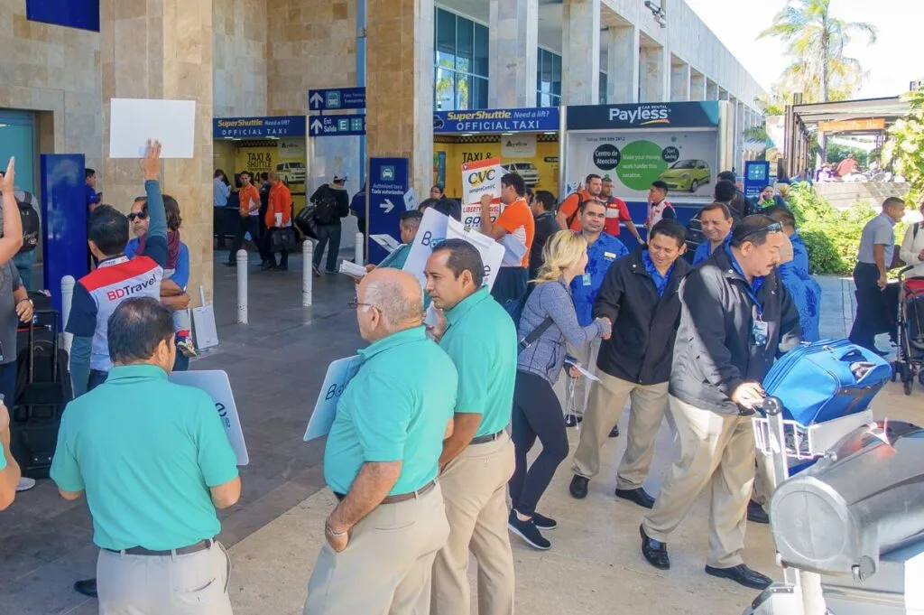 Tourists meet drivers at Cancun airport