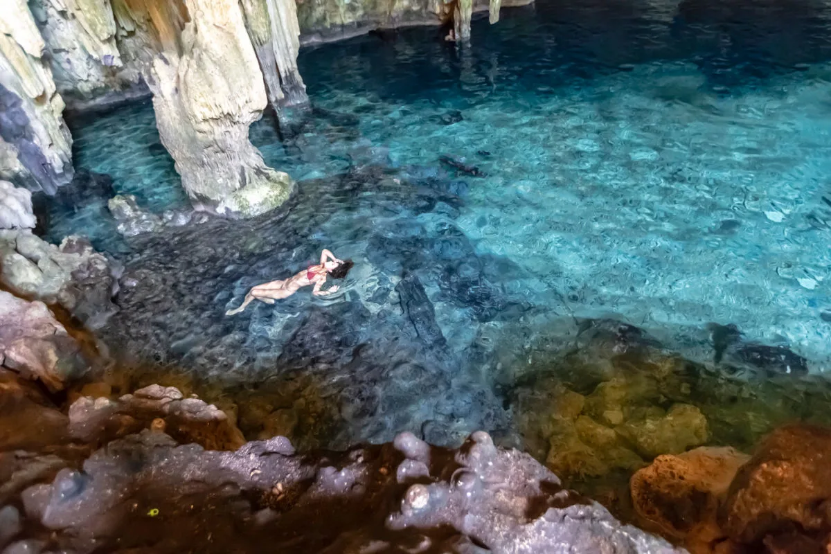 Woman floating in a cenote