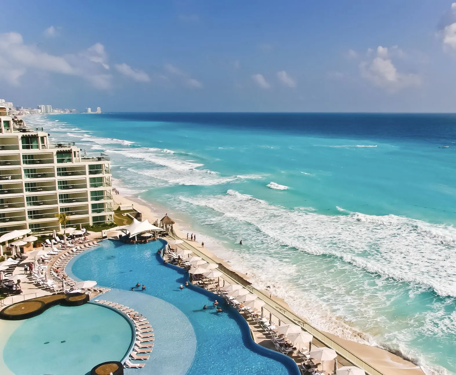 Cancun pool loungers ocean front