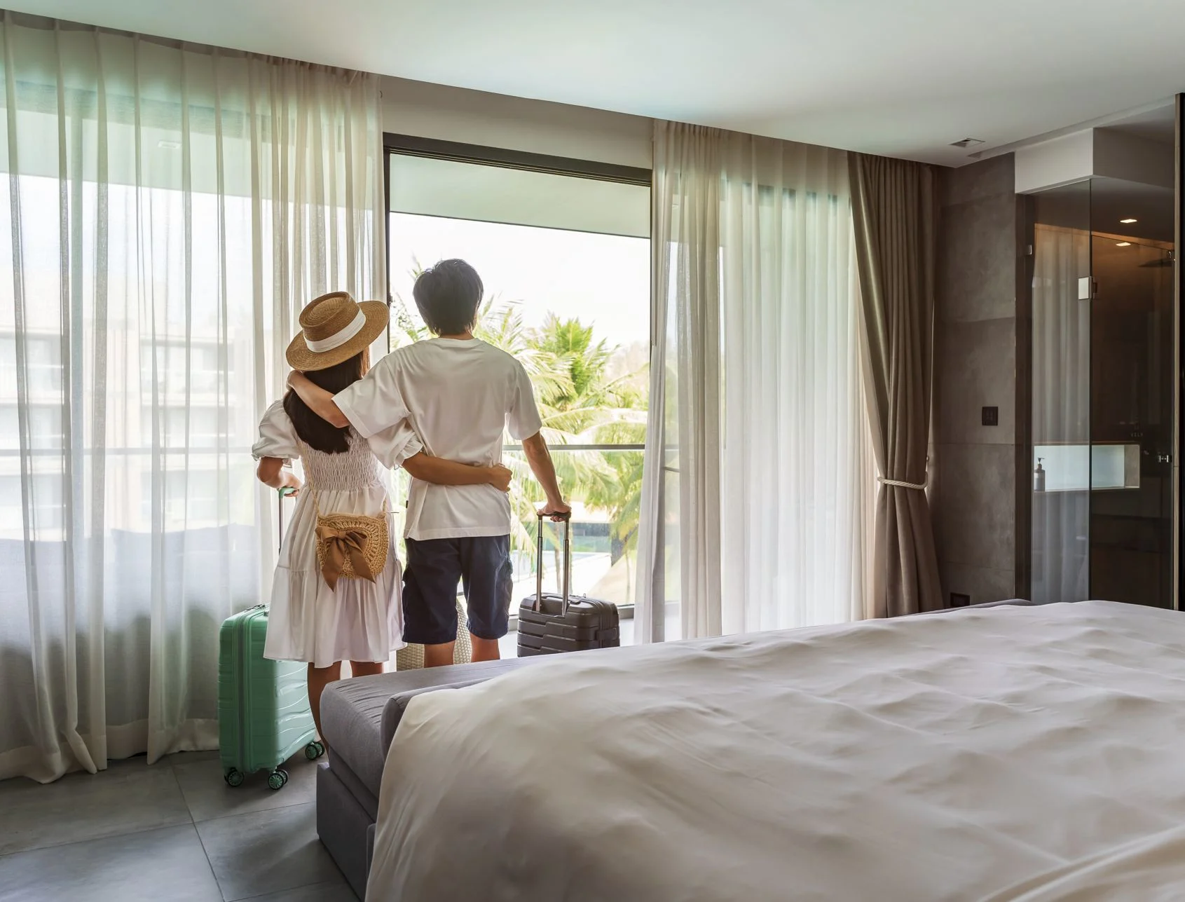 Man and woman checking into hotel