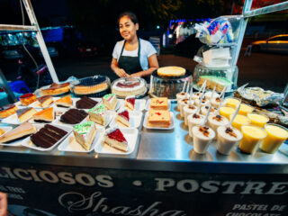 Woman in Parque de las Palapas in Cancun making street food