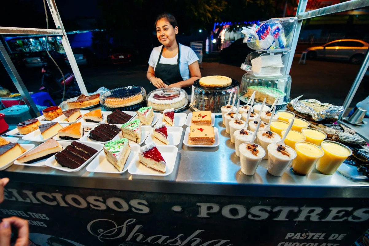 Woman in Parque de las Palapas in Cancun making street food