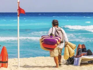 Pesos vs. Dollars In Cancun When Using USD Is Actually Costing You More Money