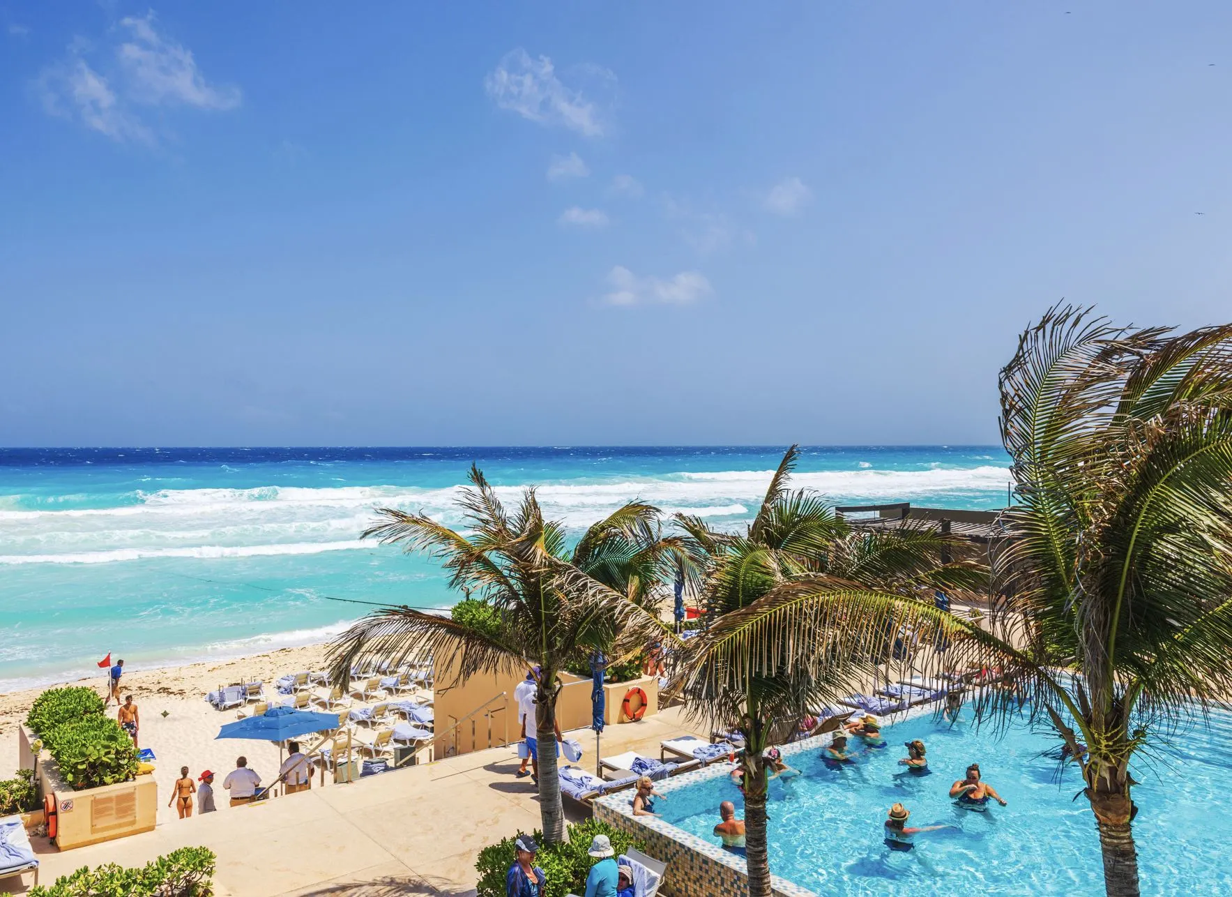 Tourists in cancun resort pool