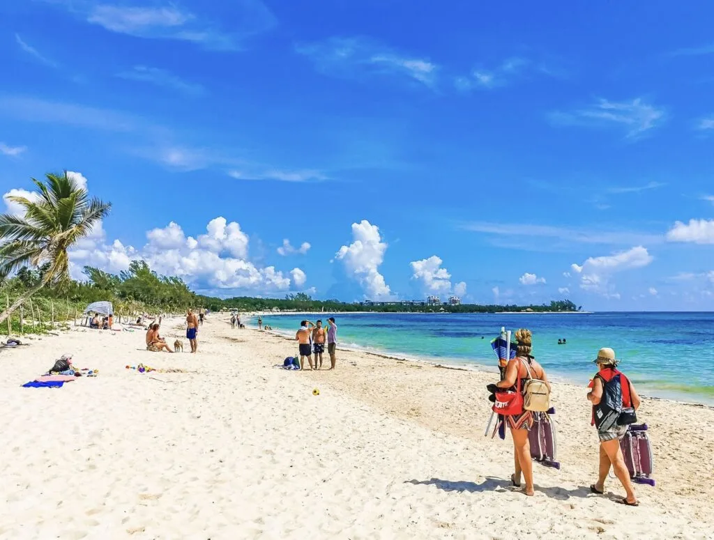 Tourists walking on beach in Playa