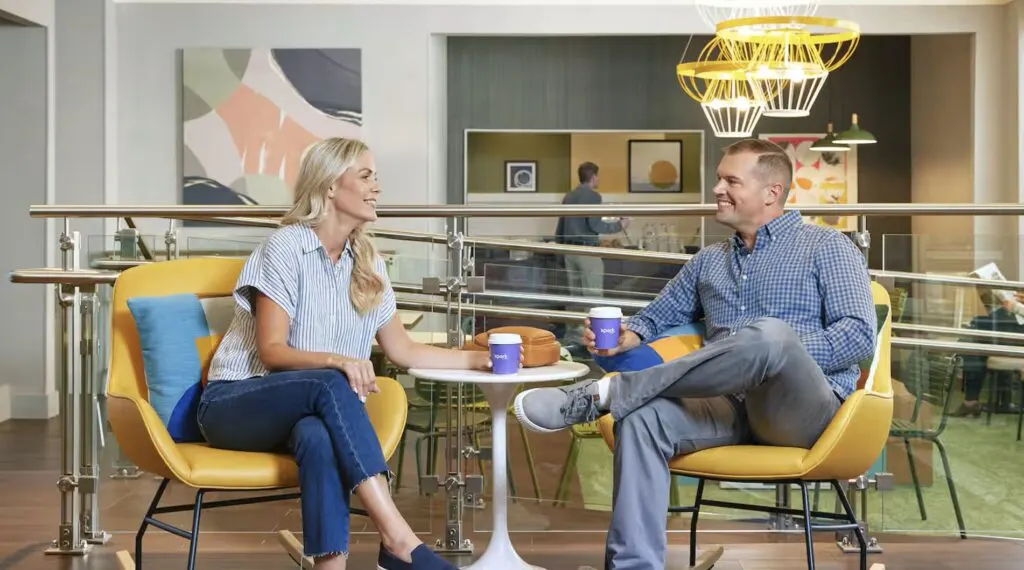 Couple enjoying coffee at Spark By hilton