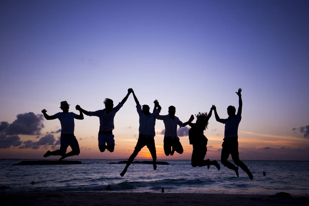 Friends on the beach at night