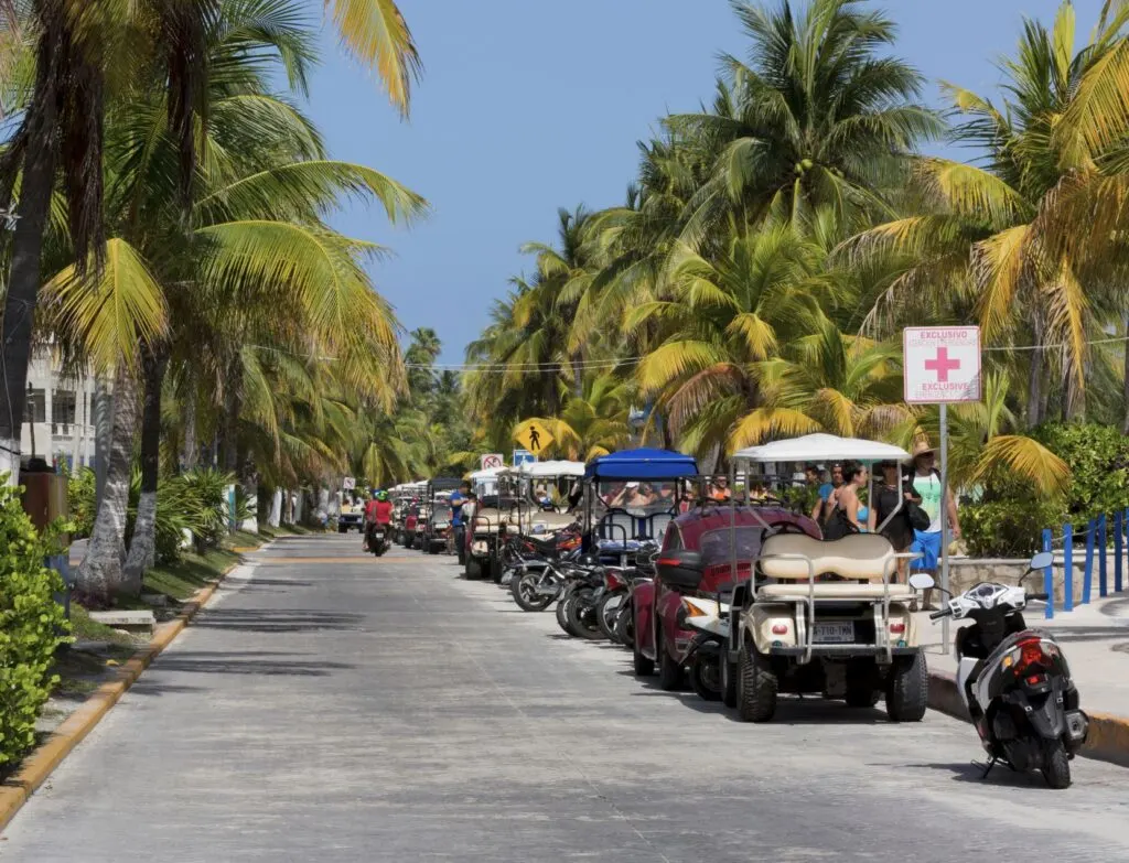 Golf carts parked Isla Mujeres