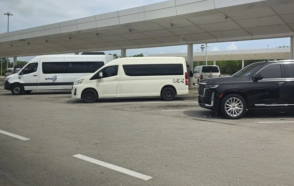 Cancun Airport Transfers vans and SUVS original Photo by Trevor Kucheran