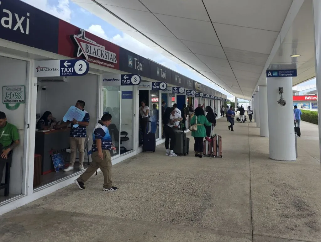 Rows of taxi providers at Cancun Airport
