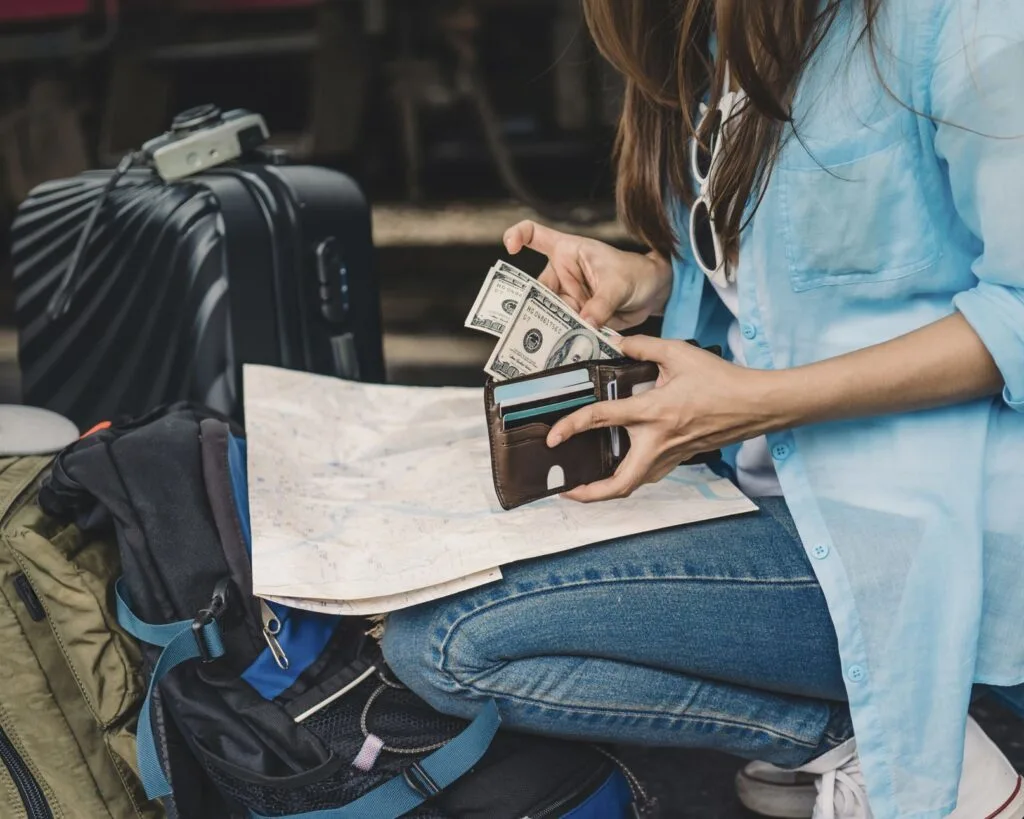 Woman organizing back up cash and cards