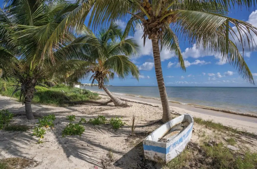 Old fishing boat on beach near Puerto Morelos